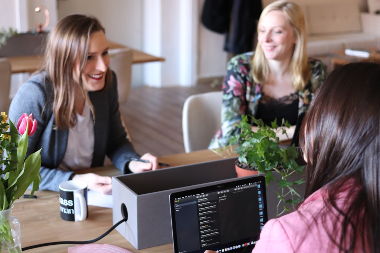 women at conference table